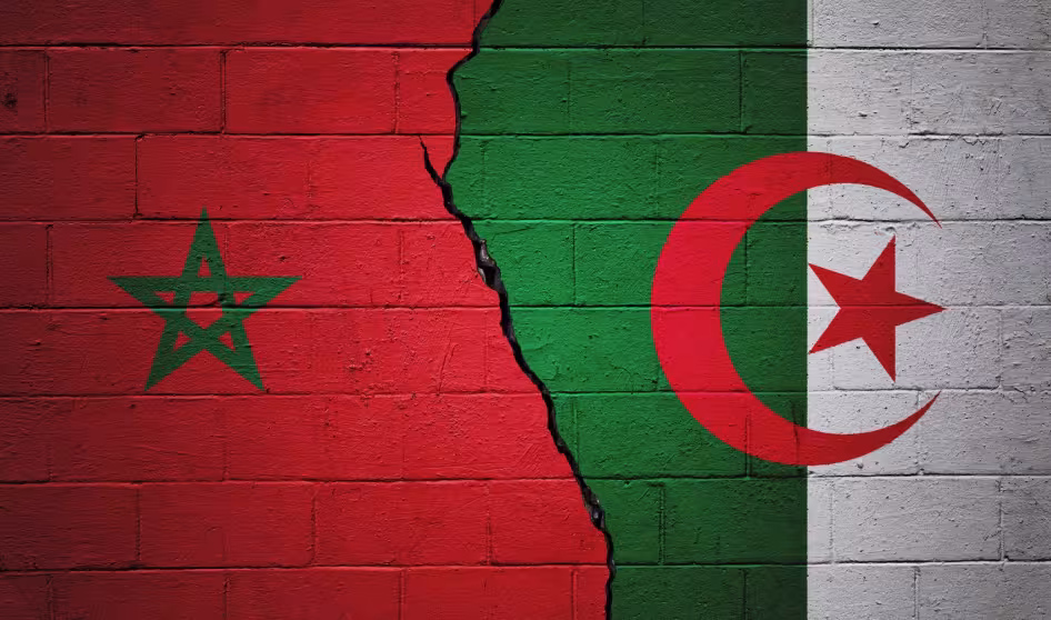Paintings of the Algerian and Moroccan flags on a brick wall