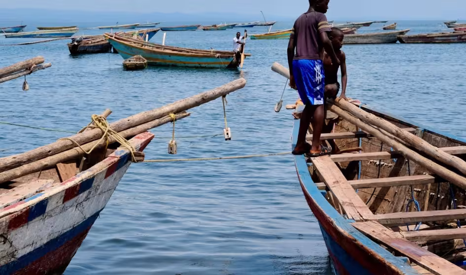 Boys on a fishing boat on the shores of Lake Tanganyika