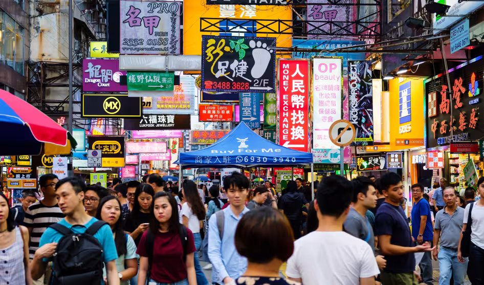 People walk through the streets of Hong Kong