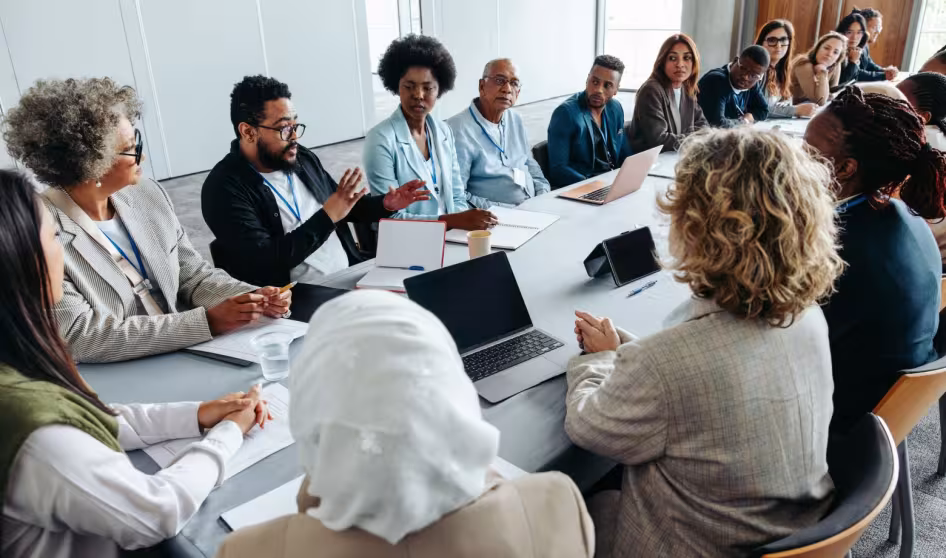 A group of people in a meeting.