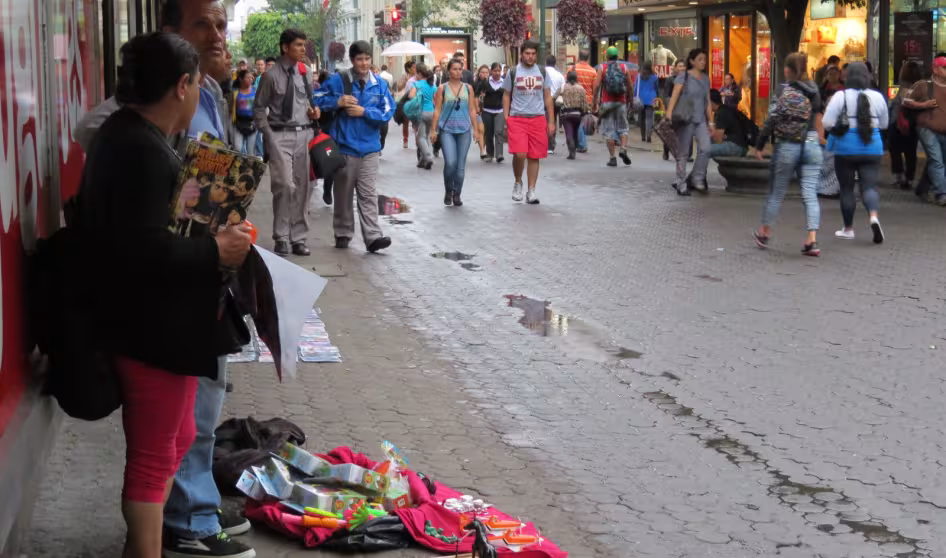 Merchants sell items on a busy street in San Jos&eacute;, Costa Rica.