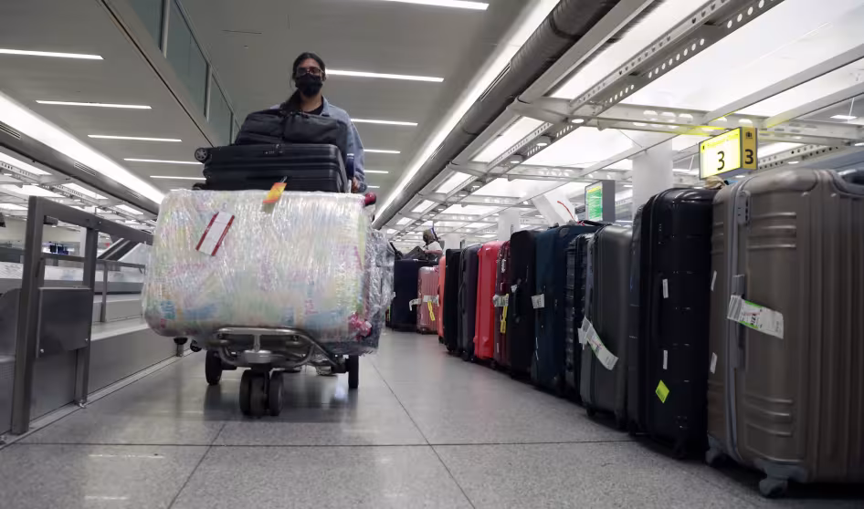 A person walks with luggage in John F. Kennedy International Airport in New York City.