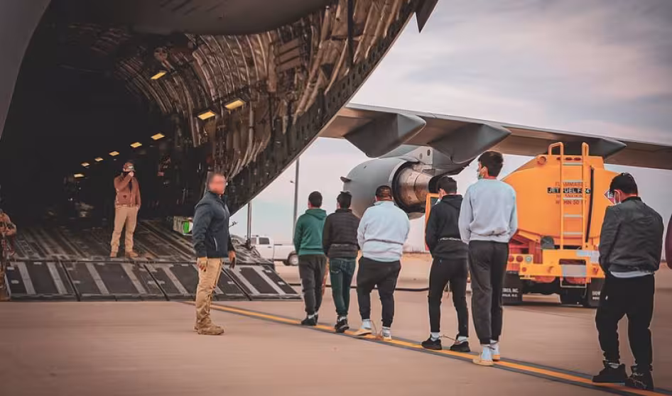 Noncitizens being deported to Ecuador board a military plane in Texas.