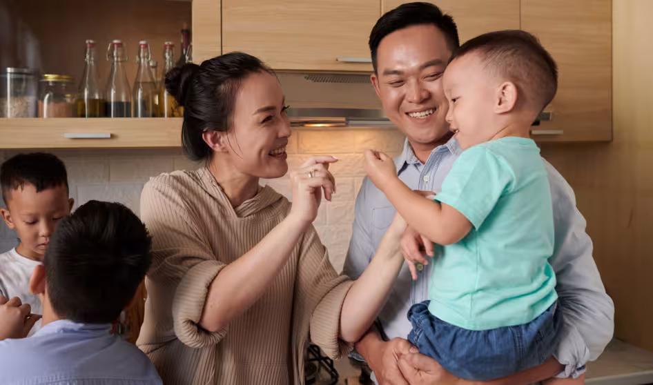 A Vietnamese family in the kitchen. 