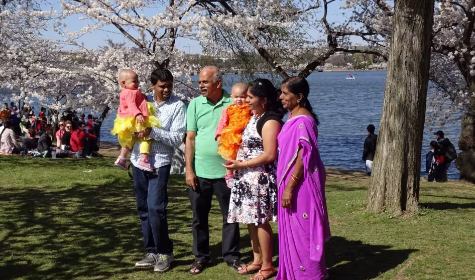 A family takes a photo in Washington, DC.