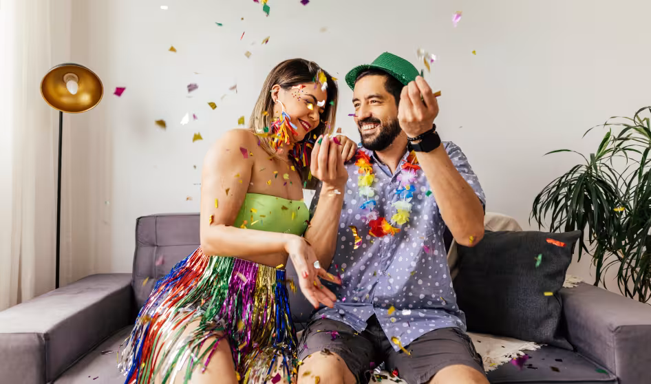A couple celebrating carnival at home.