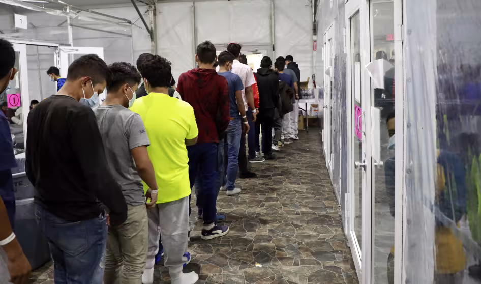 Unaccompanied minors undergo processing at a temporary facility in Texas.