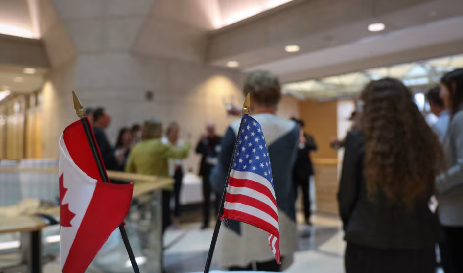 The flags of the United States and Canada.