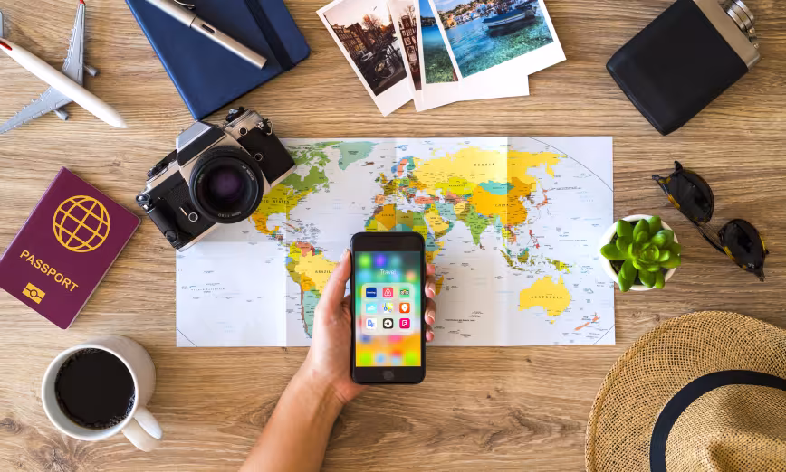 A smartphone open in front of a map of the world