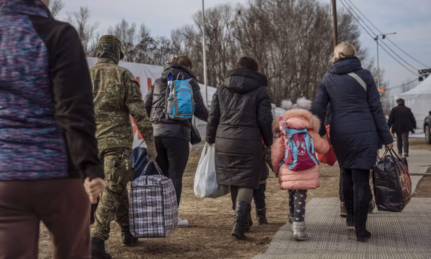Refugees from Ukraine in Slovakia walking with luggage