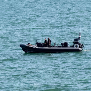 UK Border Patrol personnel in an inflatable boat 