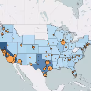 A U.S. map with states in different shades of blue and orange circles on certain metro areas