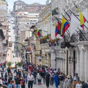 Many people walking along a busy street in Quito, Ecuador