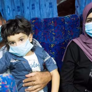 A family wearing face masks