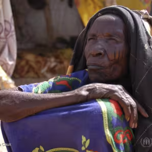 An elderly refugee woman