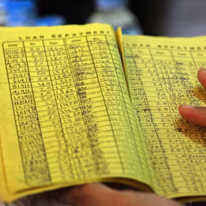 A yellow paper showing rows of loan information