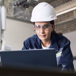 An industrial engineer working in a robotics factory.