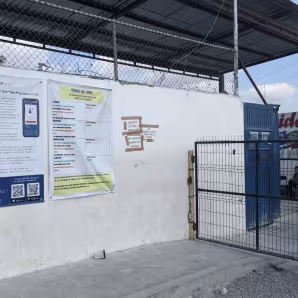 Photo of CBP One App poster at shelter in Reynosa, Mexico