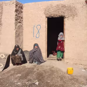 Women and children outside of home in Sohadat, Afghanistan