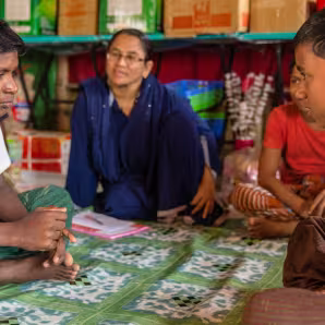 Rohingya children sit in Child Friendly Spaces in Cox's Bazar, Bangladesh