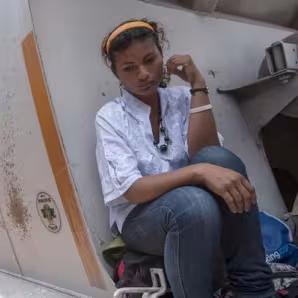 Woman sitting on freight train