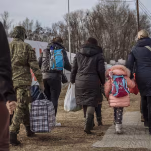 Refugees from Ukraine in Slovakia walking with luggage