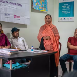 Community leaders and former returnees speak at meeting to help returnees in accessing services