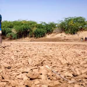 Child in dried out Dawa river bed in Somalia during drought