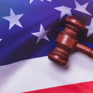 Image of gavel resting on U.S. flag
