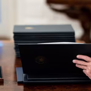 President Joe Biden looks at Executive Orders