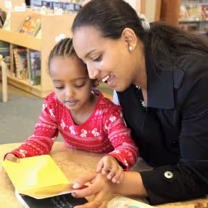Mother and child reading.