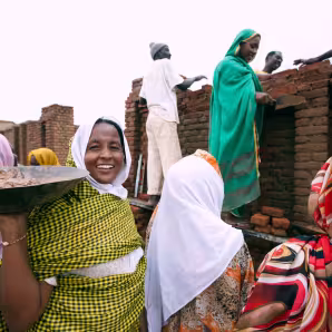 Young women in Darfur learning to construct buildings.
