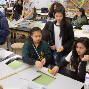High school students work on a science project
