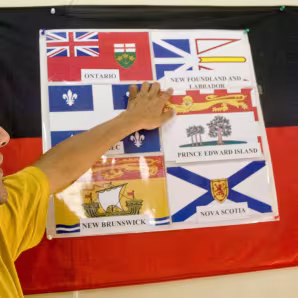 Refugee at an orientation before resettlement to Canada
