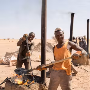 Migrants and local community members at a brick-making training in Niger
