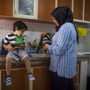 A refugee woman and child at home in Turkey