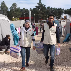 Families at Syrian refugee camp in Suruc, Turkey receive relief supplies