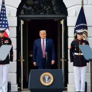 President Trump emerges from the White House to deliver remarks