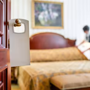 Worker cleans hotel room