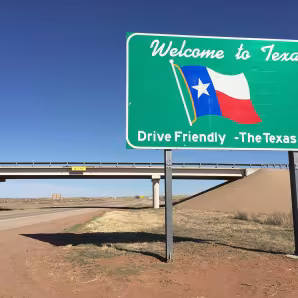 Welcome to Texas sign near highway