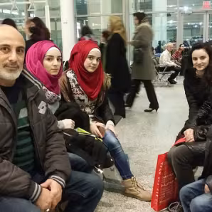 First family of refugees arrives in Toronto.