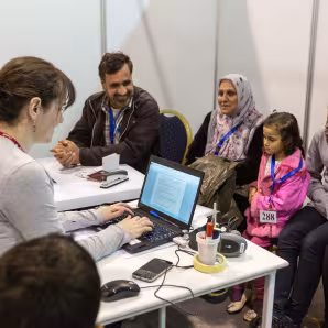 A Syrian family is interviewed by Canadian officials.