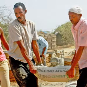Men building latrines in Dadaab refugee camp in Kenya. 