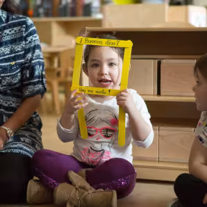 A preschool student shares how she feels during a morning greeting song