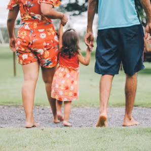 A young child and family walking