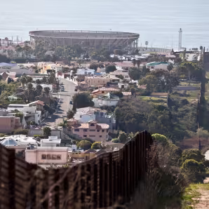 U.S.-Mexico border fence with Tijuana on the left