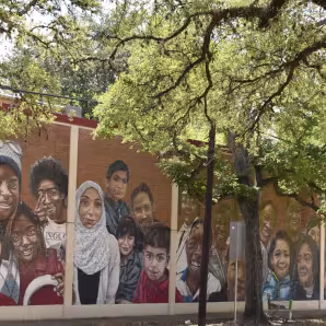 A mural on a Houston elementary school showing children of different backgrounds