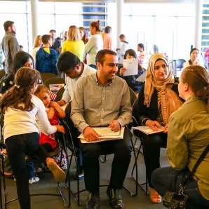 A family with young children at a naturalization ceremony.