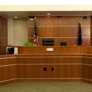 A modern courtroom with the U.S. flag