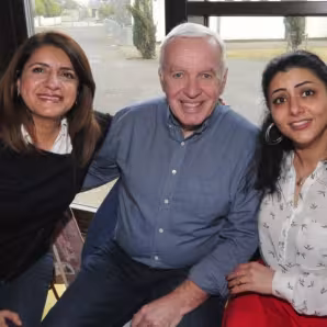 A Syrian refugee sits with her new neighbors in Ireland